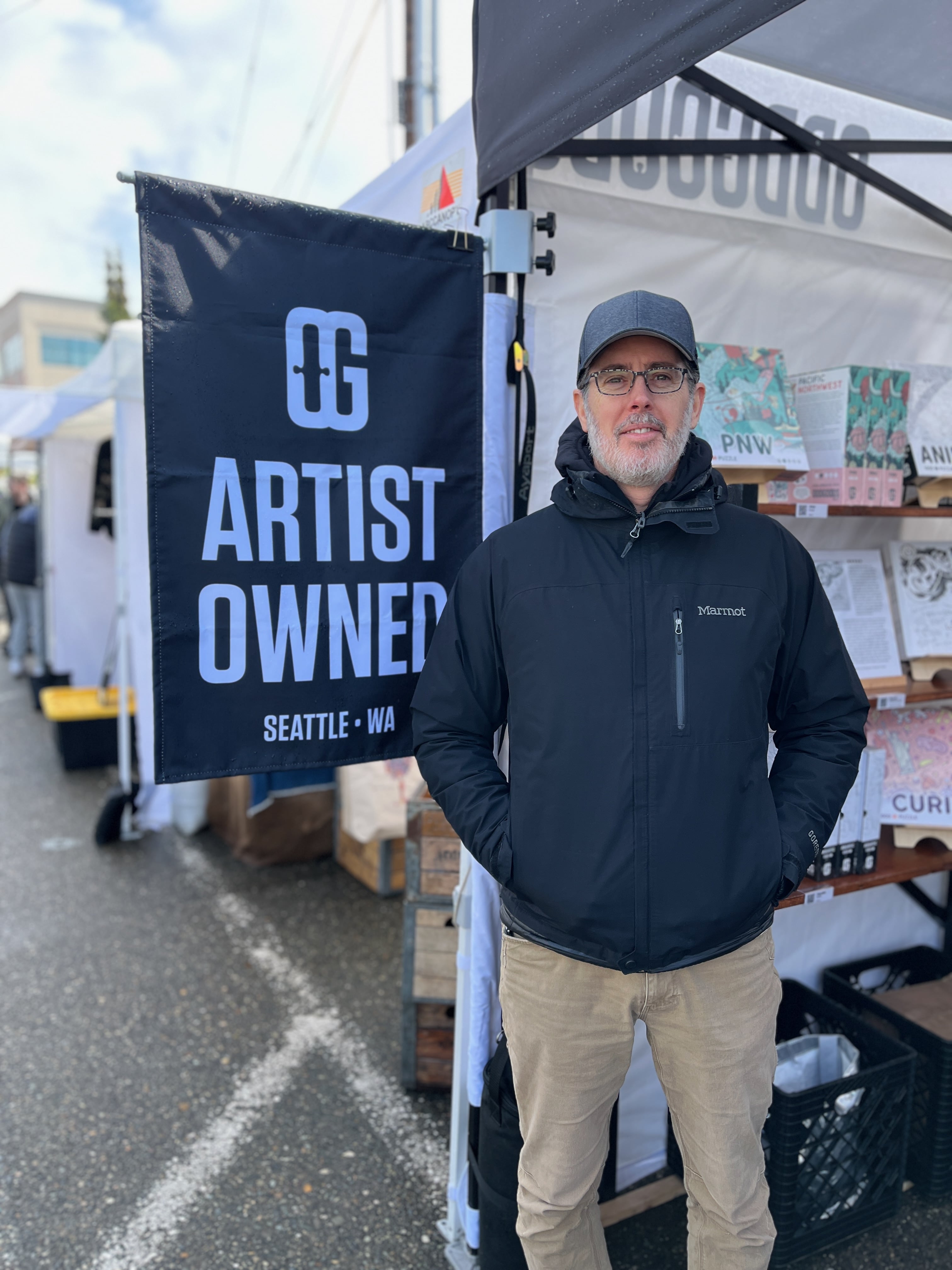 Paul Burton, owner and artist of OddGoods, posing at his tent on a typical weekend.
